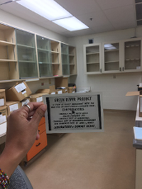 A picture of the sign at the Summit Depot laboratory (headquarters of the Green River Project) with boxes of data seen in the background.